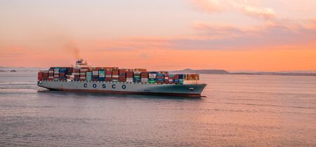 SAN FRANCISCO, CALIFORNIA - May 15, 2016: Freighters now carry most of the world's cargo and the largest container ships can carry over 21,000 units of freight.のeditorial素材