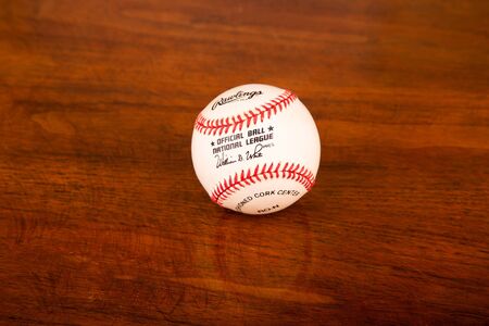 Rawlings Baseball on Wood Tableのeditorial素材