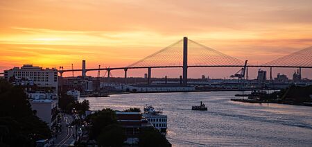 Ferry Crossing River at Sunsetの写真素材