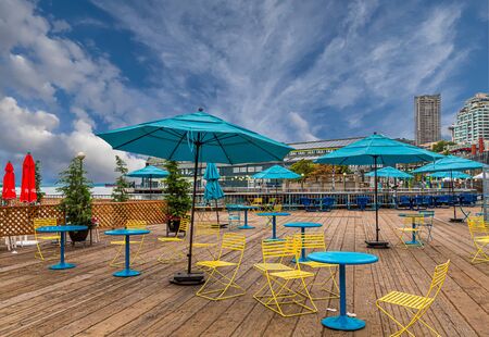 Yellow Chairs with Teal Umbrellasの写真素材