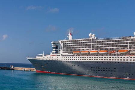 BRIDGETOWN, BARBADOS - December 2, 2017: RMS Queen Mary 2 is the largest ocean liner ever built, having served as the flagship of the Cunard Line since succeeding the Queen Elizabeth 2 in 2004.のeditorial素材