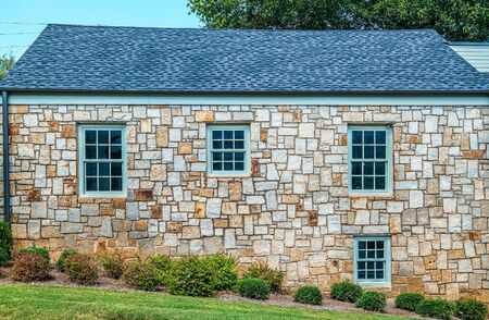 Windows in an Old Stone Wall in Buildingの写真素材