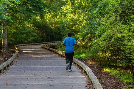 ALPHARETTA, GEORGIA -August 27, 2017: The Big Creek Greenway is over 20 miles of paved and board fitness trails spanning two counties north of Atlanta through lush green wetlands.のeditorial素材