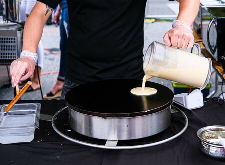 Preparing Crepes at a Night Marketの写真素材