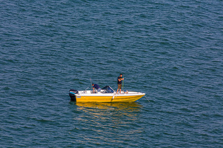 Two Fishermen in Yellow Boat