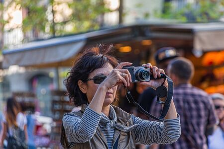 Woman Taking Picture on Streetのeditorial素材