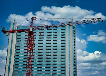 Highrise tower behind construction craneの写真素材