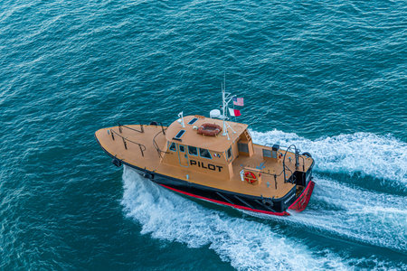 MIAMI, FLORIDA - November 26, ,2017: A pilot boat is used to transport maritime pilots between land and ships they are piloting. Modern pilot boats are built to withstand bumping against shipsのeditorial素材