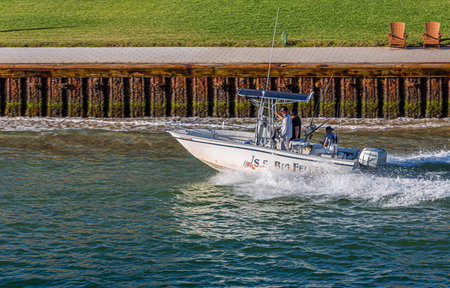 Fishing Boat Past Sea Wall