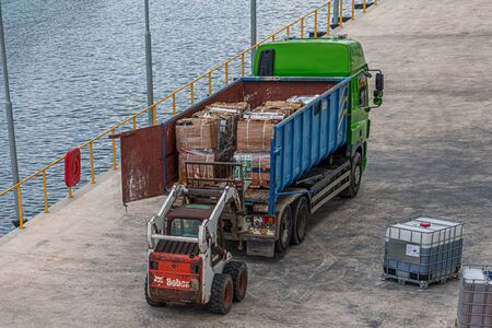 Forklift Loading Recyclables on Truckのeditorial素材