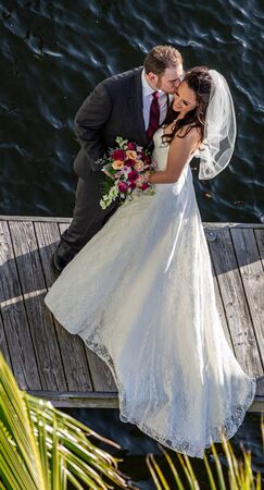 Groom Kissing Bride on Dockのeditorial素材