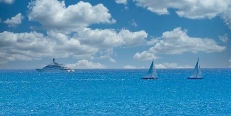 Two Sailboats and Yacht on Blue Horizonの写真素材