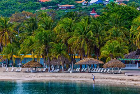 Man Alone on Tropical Resort Beachのeditorial素材