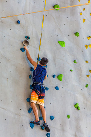 Wall Climber Ringing the Bell