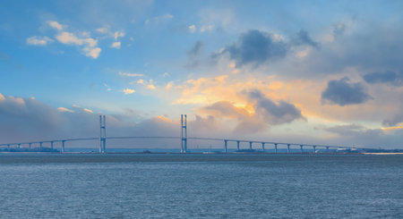 Suspension Bridge Through Blue Haze at Sunset