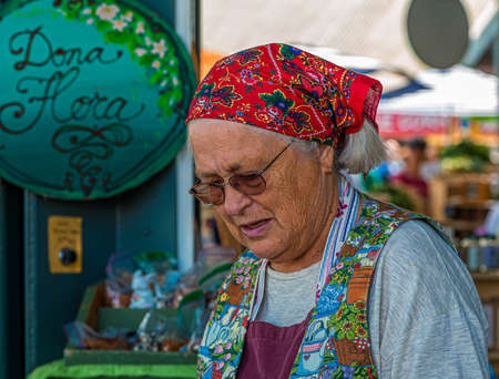 Old Farming Woman Working Marketのeditorial素材