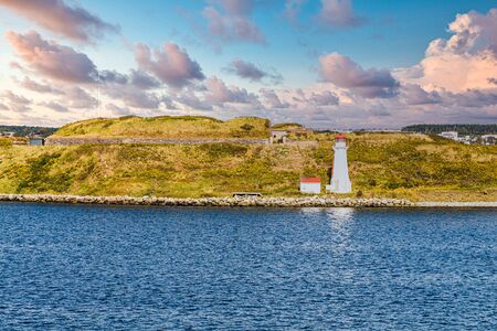 White Lighthouse by Blue Waterの写真素材