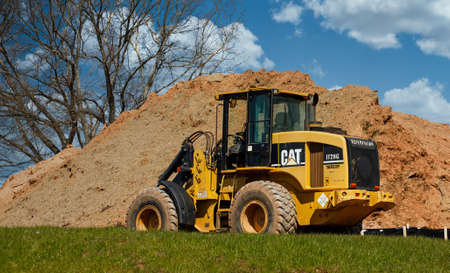 CAT Heavy Equipment by Dirt PIleのeditorial素材