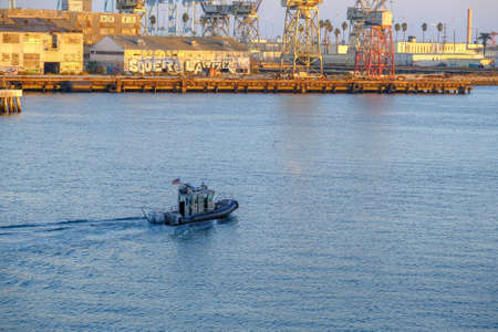 Police Boat in Industrial Harborのeditorial素材