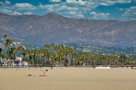 Mountains Beyond Palm Trees and Beachのeditorial素材