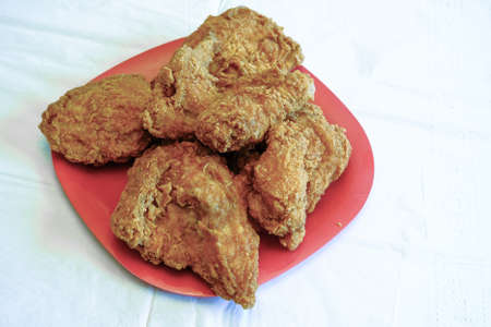 Crispy Fried Chicken on Red Plateの写真素材