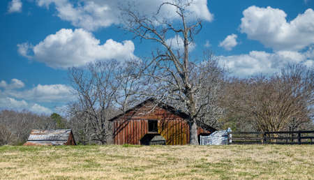 Old Barns in Winter Fieldの写真素材