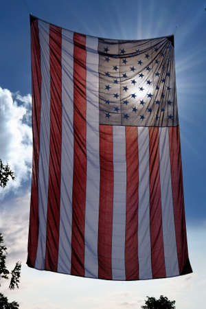 Sun Behind American Flag Hangingの写真素材