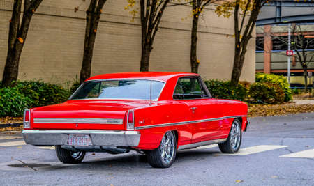 Red Chevy Nova Leaving Car Showのeditorial素材