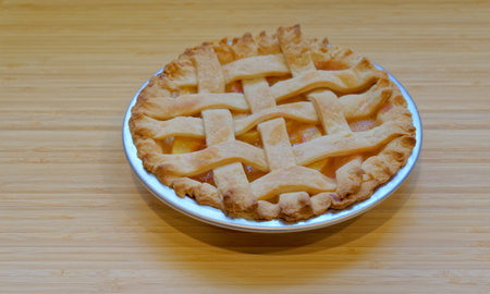 Peach Pie on Cutting Boardの写真素材