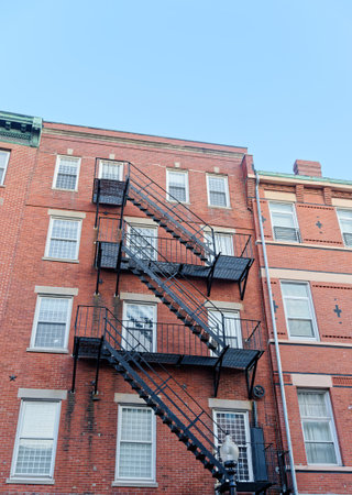 Black Iron Fire Escape on Brick Buildingのeditorial素材