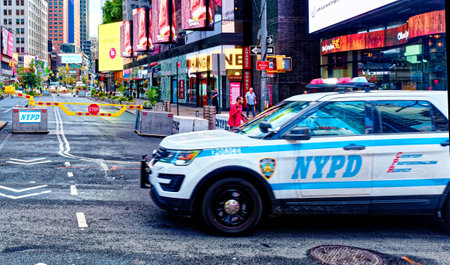 NYPD Car Crossing Times Squareのeditorial素材