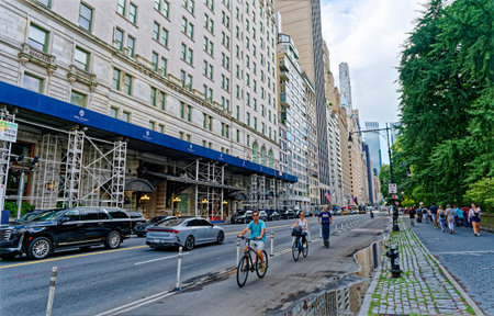 Cyclists Past The Plaza Hotel