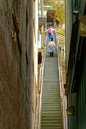 People Climbing Narrow Staircase in Juneau, Alaskaのeditorial素材