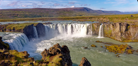 Godafoss waterfall in Iceland, showcasing the natural beauty of the cascading waters and surrounding landscape.の写真素材