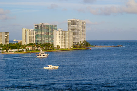 Boats Past Coastal Condos in Port Evergladesのeditorial素材