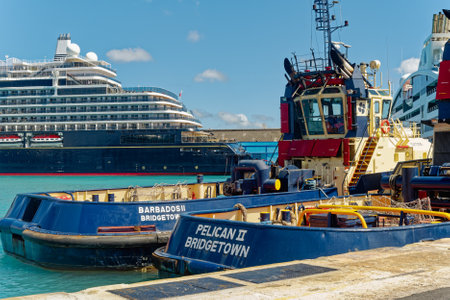 Tugboats and Explora Cruise Ship in Bridgetown Barbadosのeditorial素材