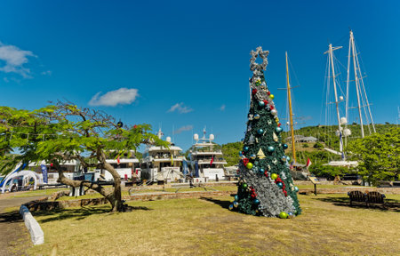 Yachts at Nelsons Dockyard on Antigua with Christmas Treeのeditorial素材