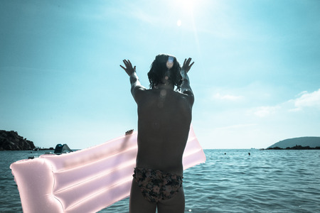 a child plays in elba island, italyの写真素材