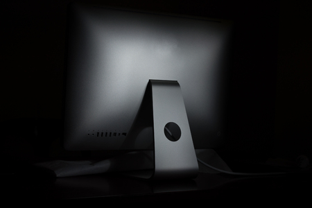 light painting on computer desktop in a dark backgroundの写真素材