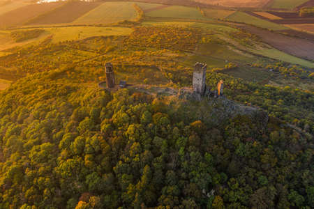 Hazmburk is a mountain peak in the Ceske Stredohori range found in the Czech Republic. At the top of the mountain there is a ruin of a mediaeval castle, of which two towers and some wall fragments.の写真素材