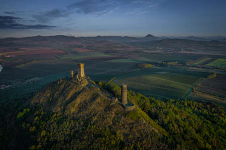 Hazmburk is a mountain peak in the Ceske Stredohori range found in the Czech Republic. At the top of the mountain there is a ruin of a mediaeval castle, of which two towers and some wall fragments.の写真素材