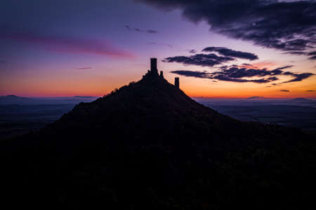 Hazmburk is a mountain peak in the Ceske Stredohori range found in the Czech Republic. At the top of the mountain there is a ruin of a mediaeval castle, of which two towers and some wall fragments.の写真素材