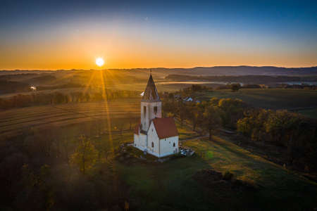Church of St. Nicholas St. James in Chvojno dates from the 13th century. It is located on the hill above the Baroque farmyard Chvojen in the cadastral area of Benesov near Prague.の写真素材