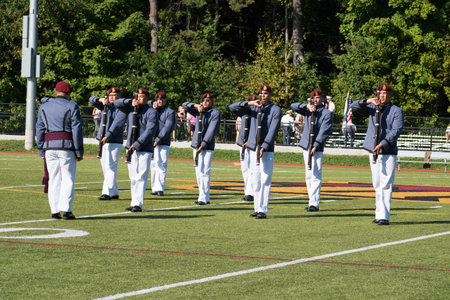 Norwich University's drill team performs during the half-time of a college football game