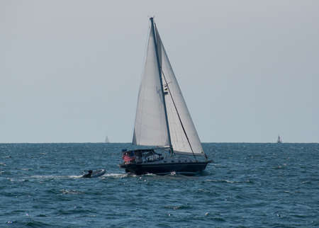 A sailboat sailing awayのeditorial素材