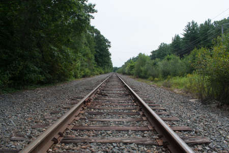 A set of train tracks rolls off into the distanceの写真素材