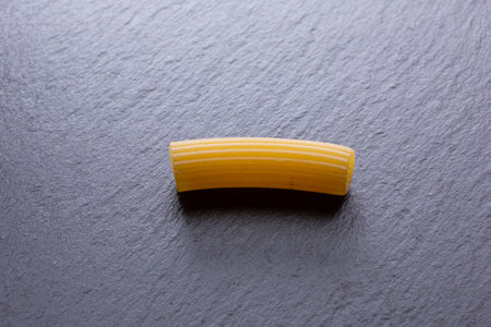 Raw pasta on a black slate background. Top view. Copy space.の写真素材