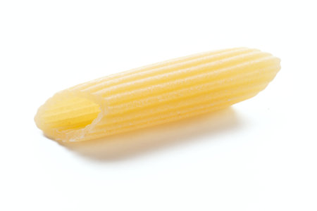 close up of a penne pasta on white background.の写真素材