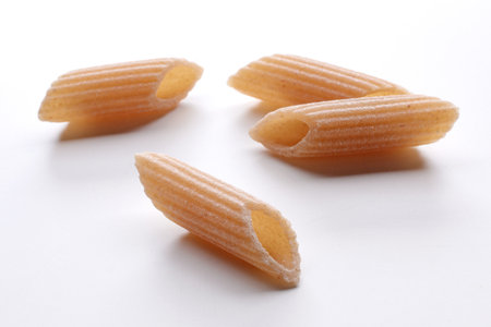 close up of a penne pasta on white background with copy spaceの写真素材