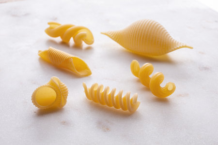 Different types of pasta on a white background. Close up.の写真素材